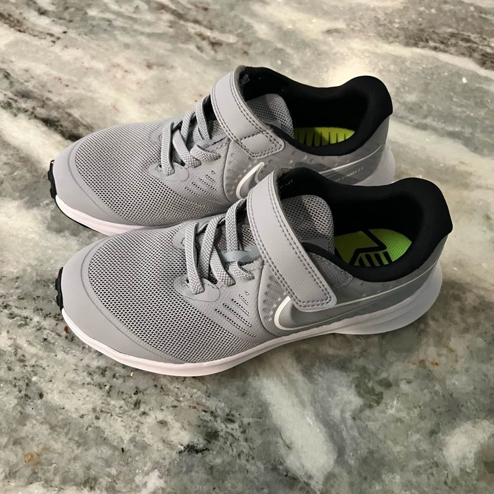 Kids/ little boys run fast Nike shoes brand new, never worn